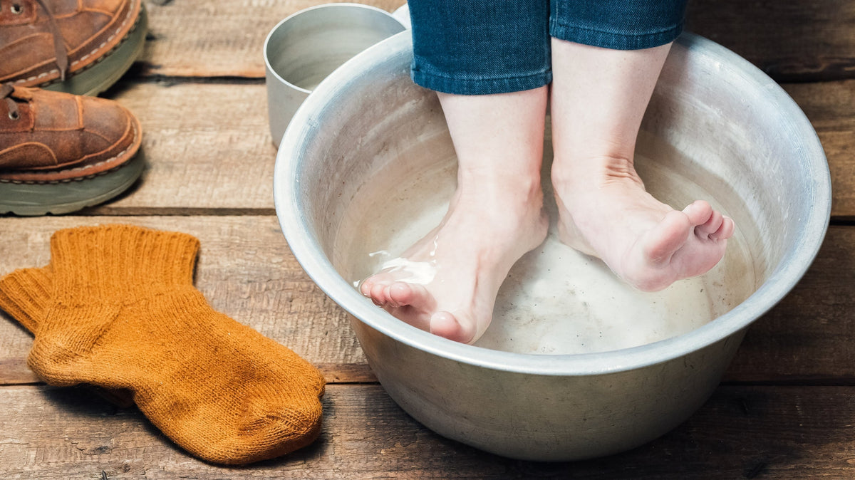 Soaking feet in warm water after frostbite