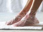 Two Baby Foot exfoliating foot peel packs showing the clear foot peel gel bottles on a white background.
