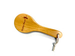 Baby Foot foot brush for exfoliating and cleaning feet, shown in use with soft bristles for gentle foot care.
