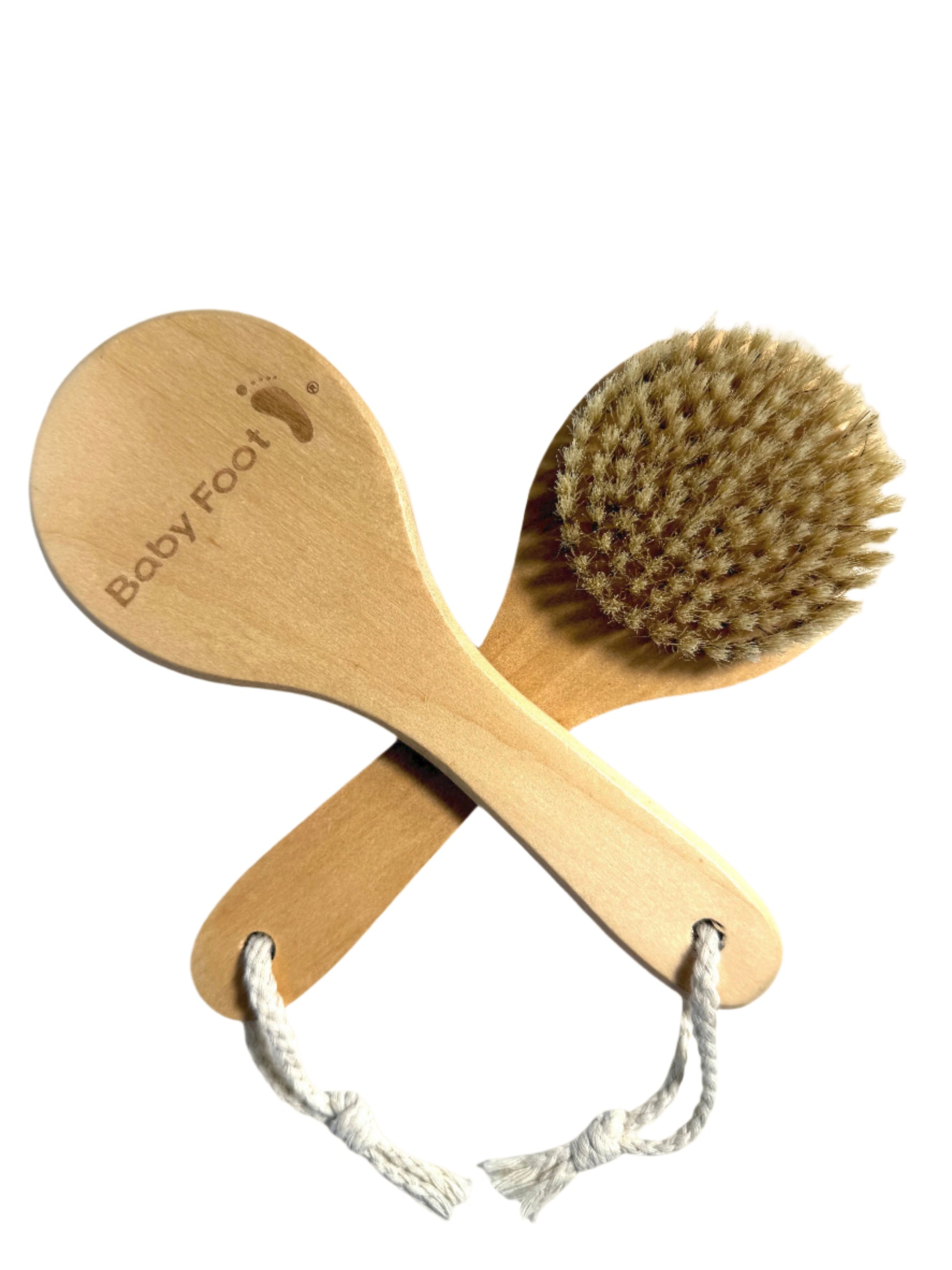 Baby Foot foot brush for exfoliating and cleaning feet, featuring soft bristles and ergonomic handle for effective foot care.